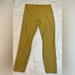 Fabletics High-Waisted Cold Weather Reflective Pocket Leggings Gold Women’s L